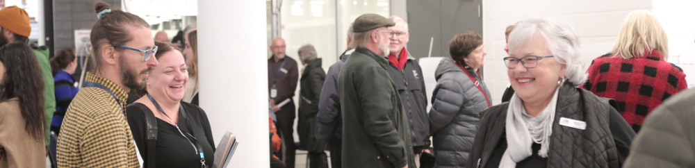 Image features attendees for a public open house to discuss the new Main Branch Library in Paris, Ontario.