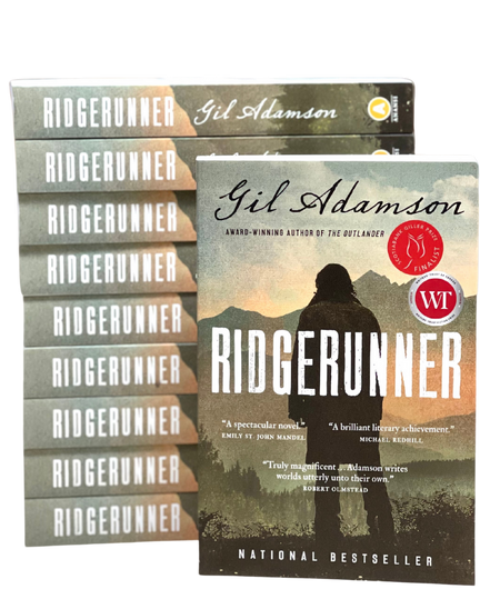 A stack of copies of the book Ridgerunner by Gil Adamson.