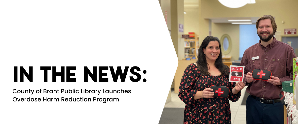 Text reads, "In the news: County of Brant Public Library Launches Overdose Harm Reduction Program." A picture to the right features two library staff holding black and red naloxone kits.
