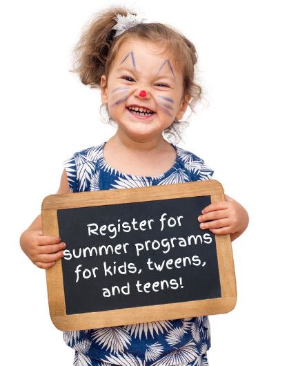 Toddler holding with a painted kitten face, holding a small blackboard that reads, "Register for programs for kids, tweens, and teens."